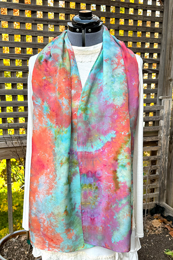 Women's wearable art ice dyed long silk scarf hand dyed with different shades of pink, peach, purple, turquoise and green - Blooms in the Lagoon