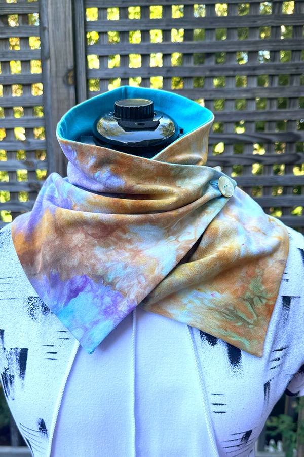 Women's wearable art hand ice dyed cotton neck warmer scarf with button in the different shades of marigold yellow, bronze, aqua and lavender - Elisa